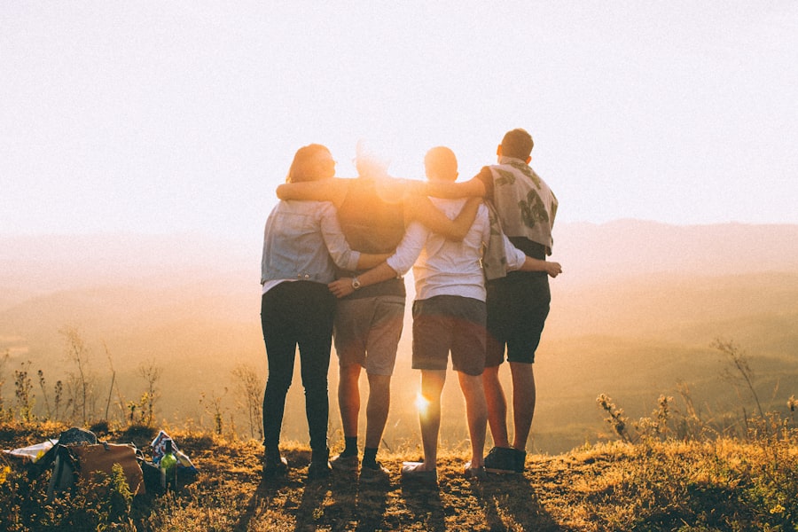 A small group walking together at sunrise