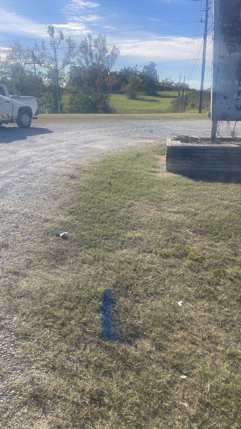 10/20: blue (water) line through the grass right by the sign planter
