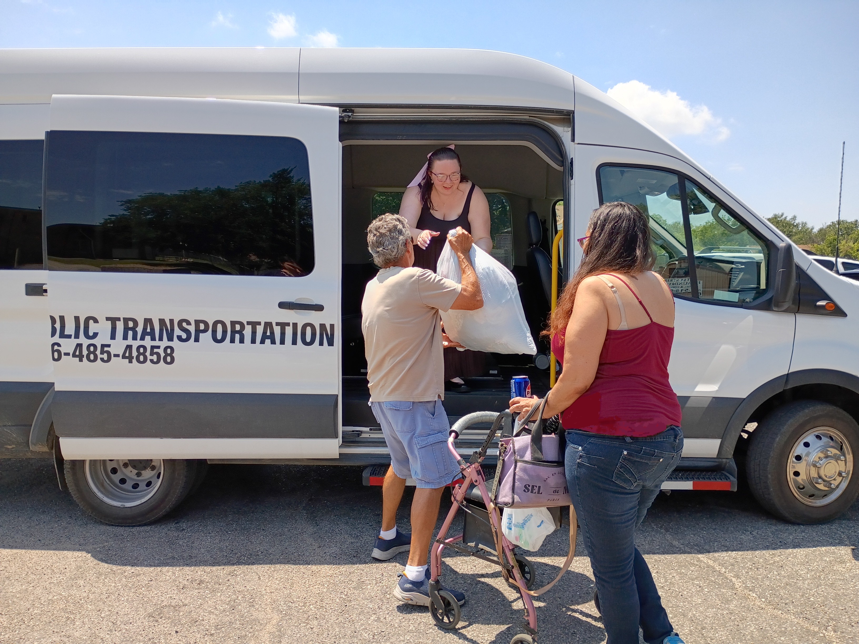 LHEAT Transport driver helping a rider